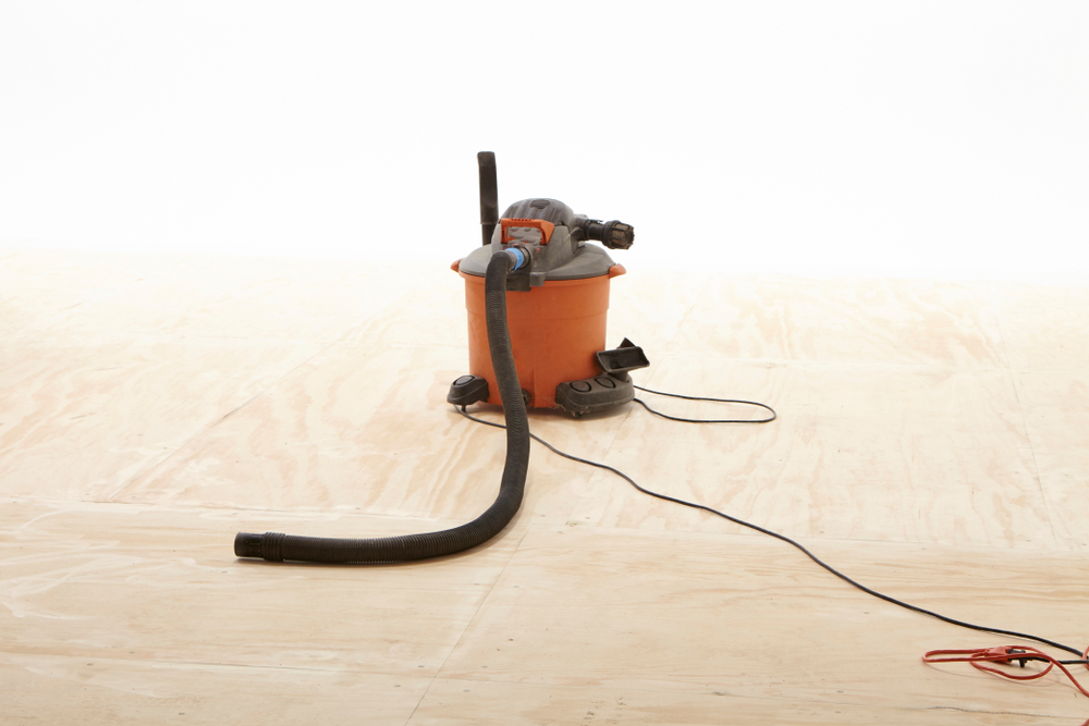 lone shop vac on wood floor