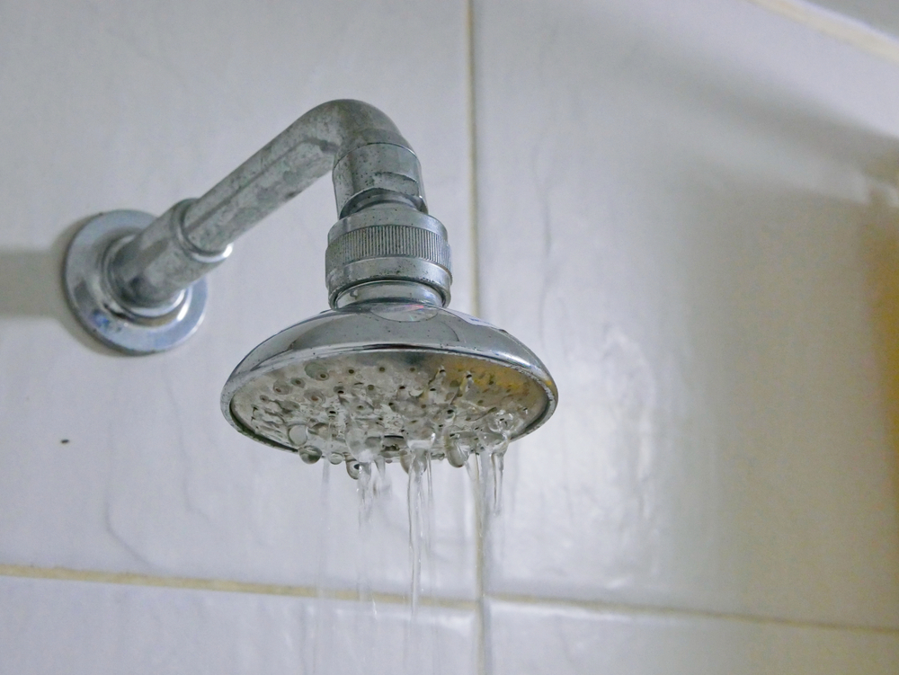 A clogged showerhead with low water pressure