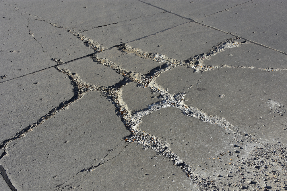 A cracked concrete driveway