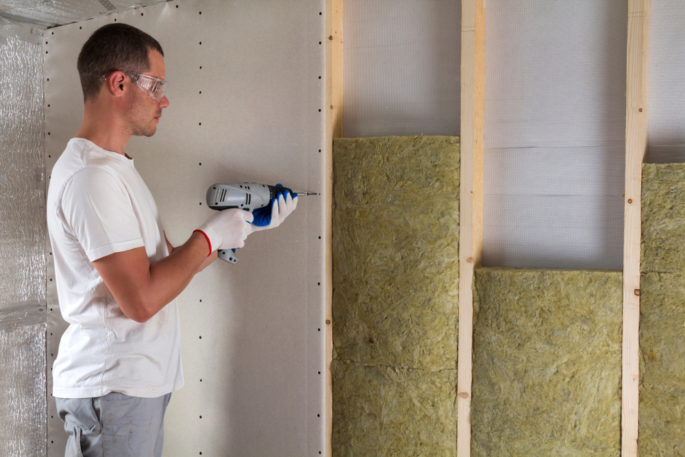 Man installing drywall