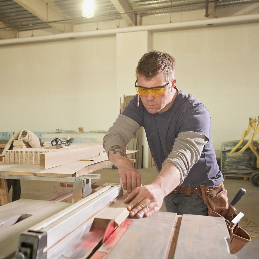 man uses a table saw