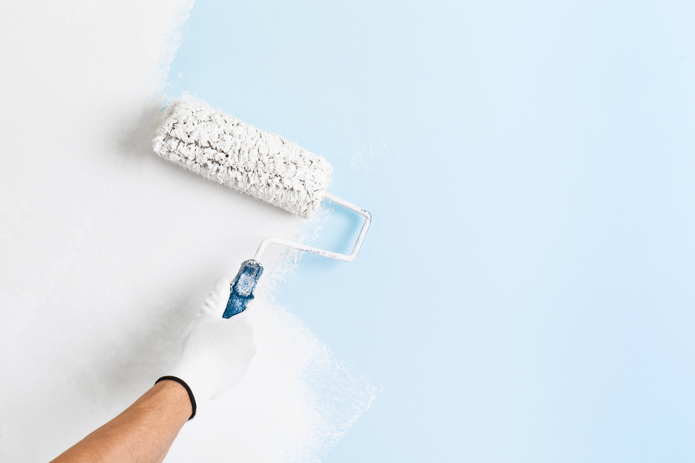 paint roller painting wall