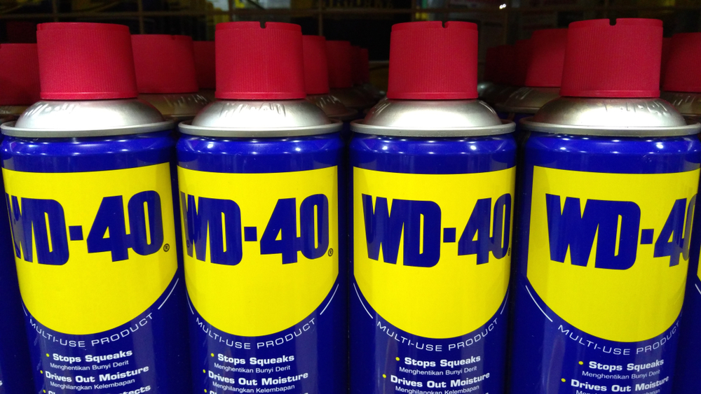 row of WD40 cans in a store