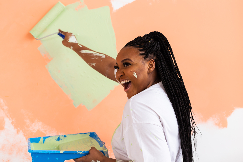 woman painting wall