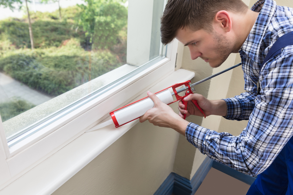 Applying new caulk after removing the old