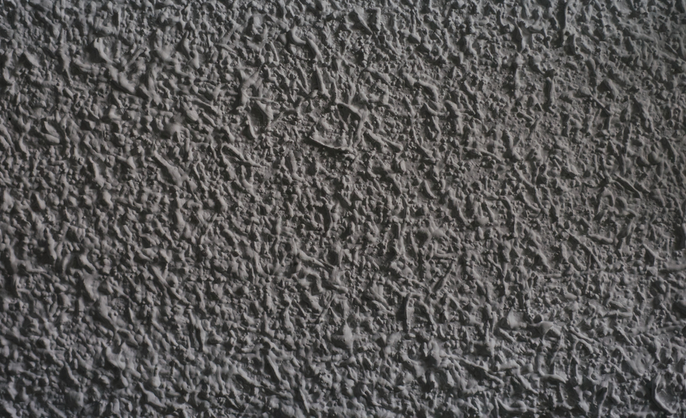Grey popcorn texture on a wall