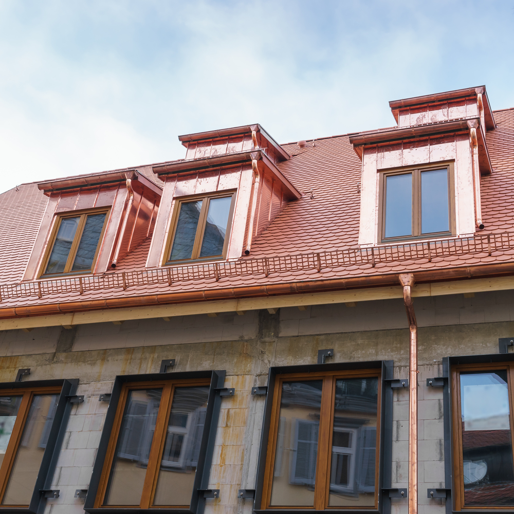 copper shingles on a large building