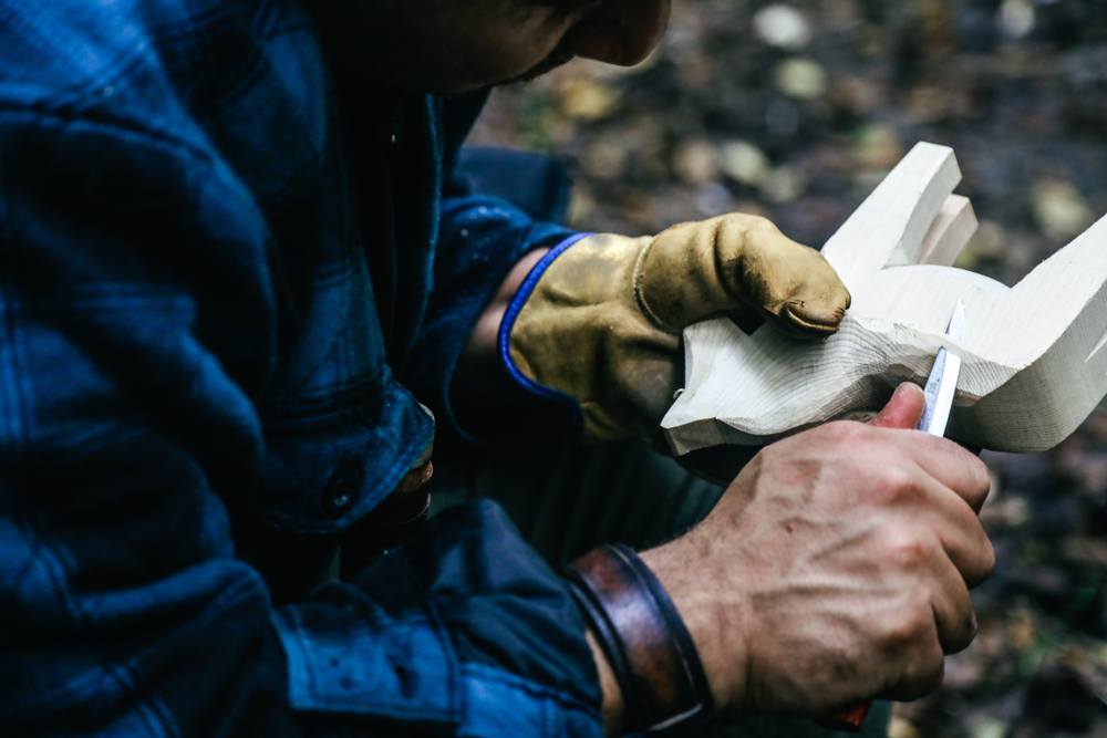 Man whittling a horse