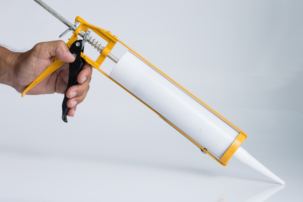 close up of silicone caulking gun