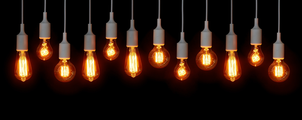illuminated lightbulbs against black background